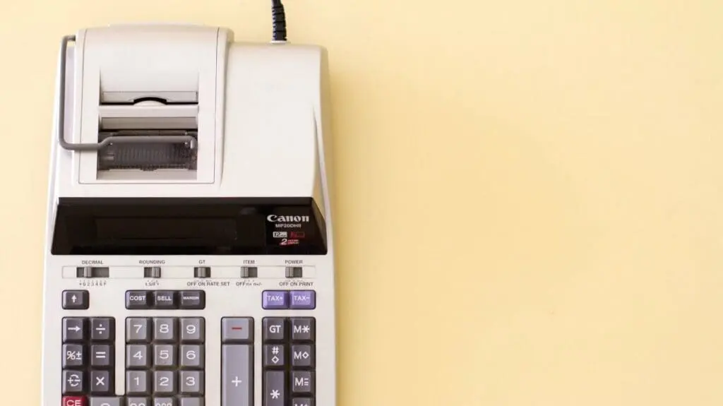 Calculator on an orange background.